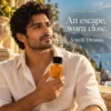 amalfi dreams 2nd image Golden Aura Amalfi Dreams Extrait de Parfum campaign model holding luxury woody amber men's fragrance bottle